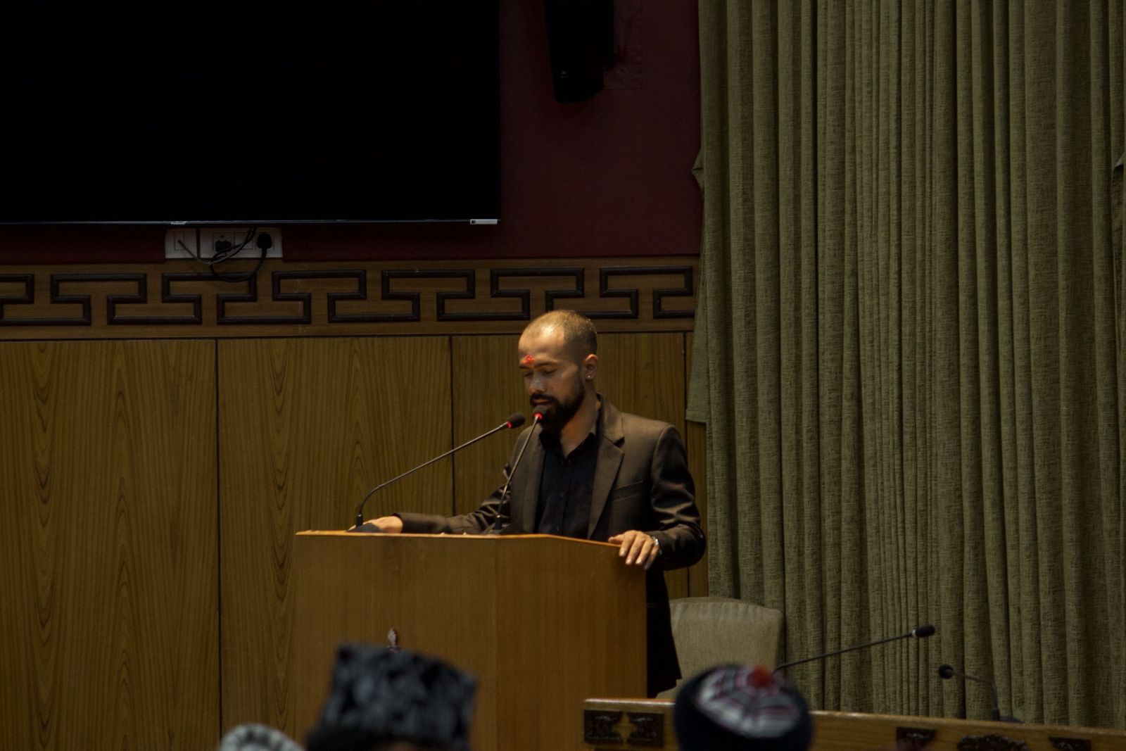 At the podium